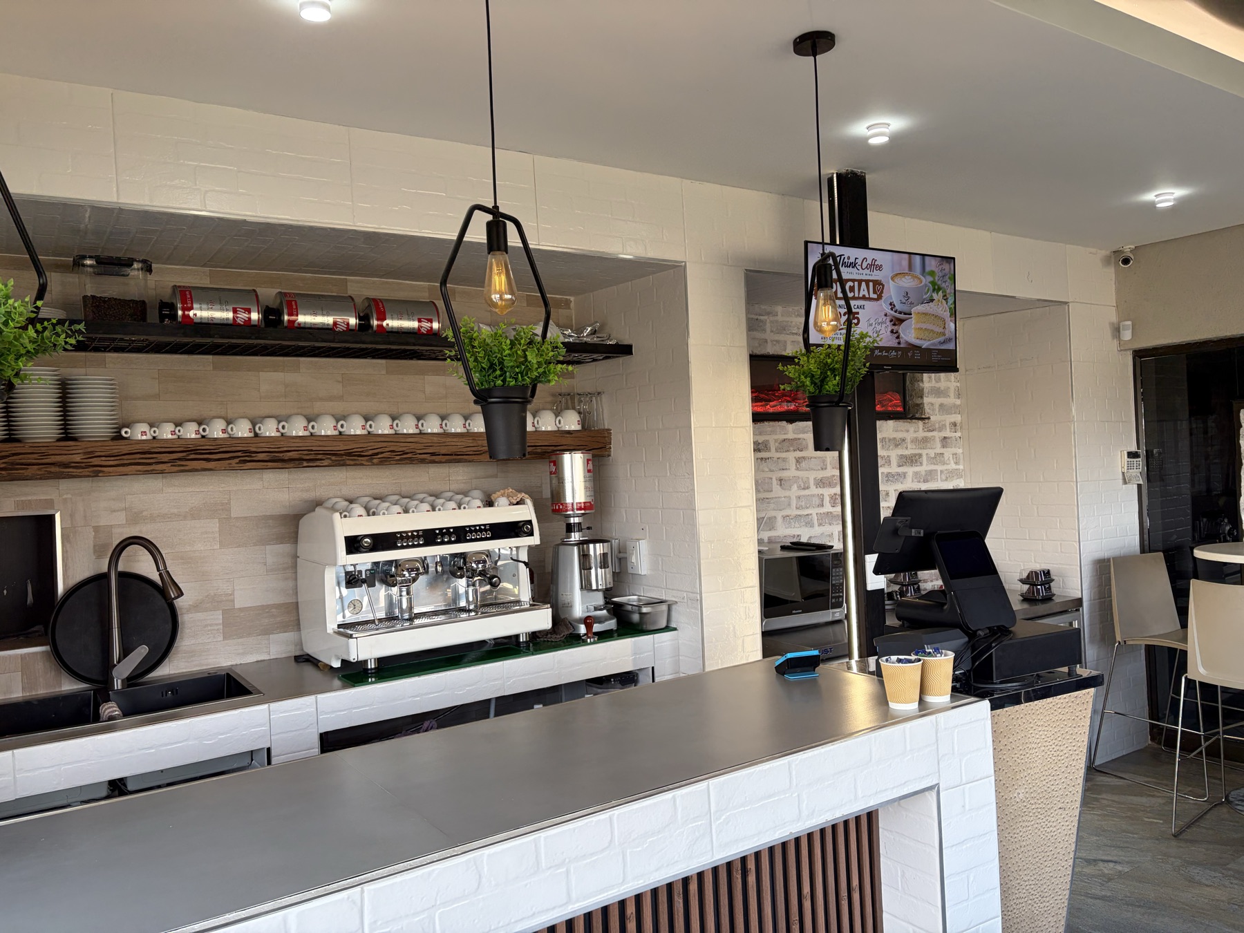 Coffee counter with the specials board on screen